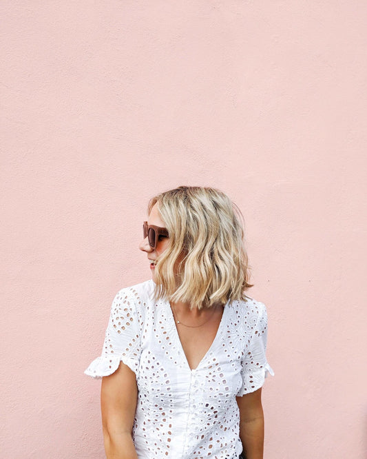 model standing in front of pink wall